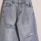 Jeans Gamba Larga Con Rotture
